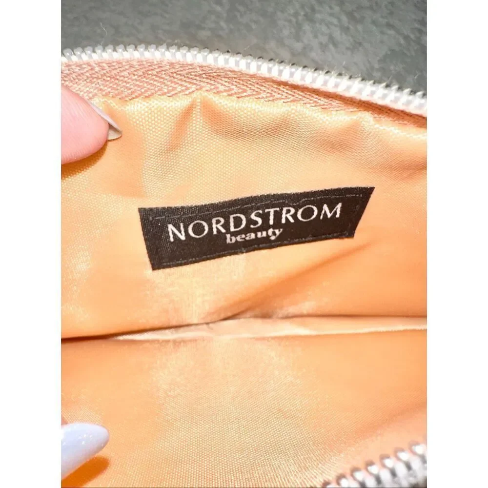 Nordstrom‘s Rose gold cosmetic bag with tassel